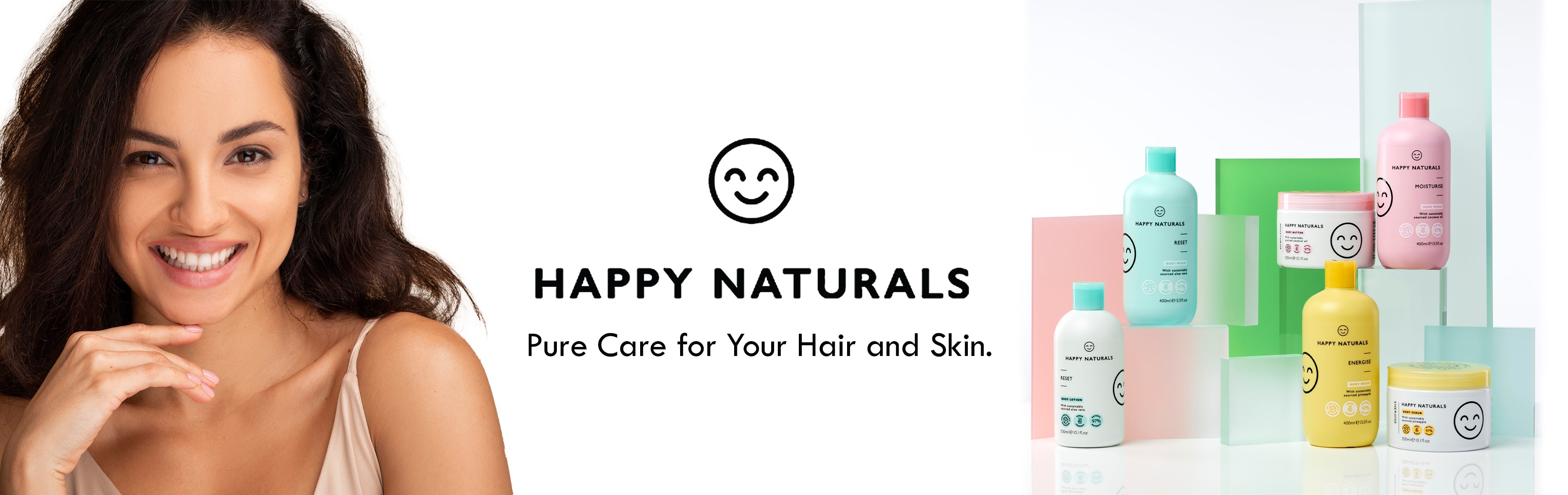 Happy Naturals hair and skin care products with smiling woman, featuring body wash, lotion, and scrub