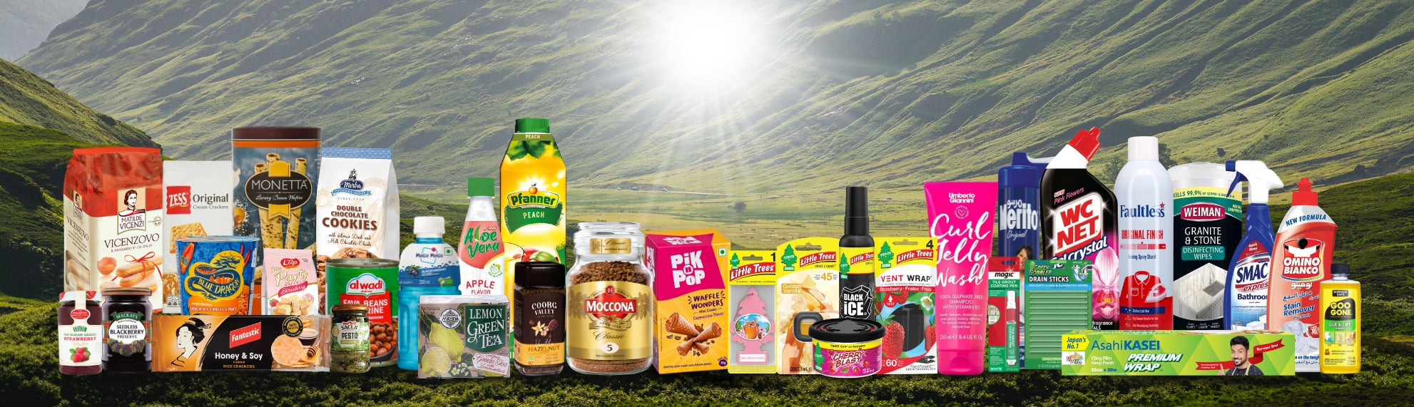 Assorted international gourmet foods, beverages, snacks, and home care products displayed outdoors