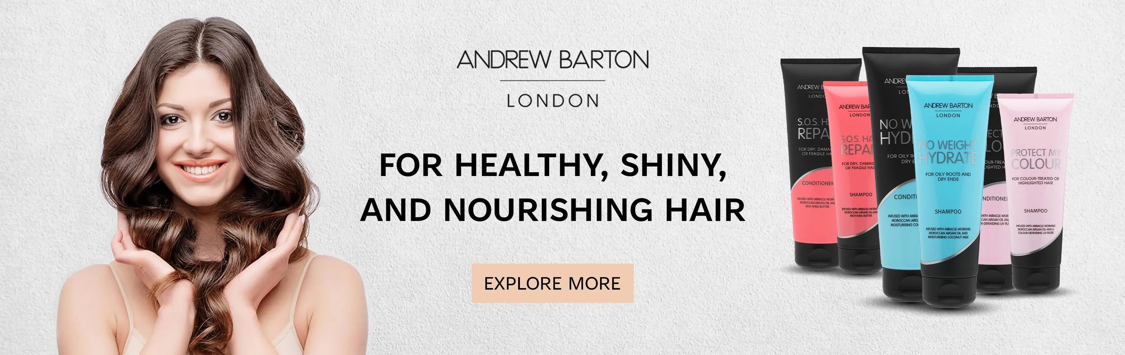 Smiling woman with shiny hair next to Andrew Barton London hair care products and text promoting healthy, nourished hair.