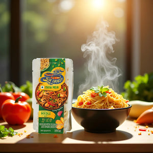Blue Dragon chow mein noodle kit package beside steaming bowl of cooked noodles with vegetables