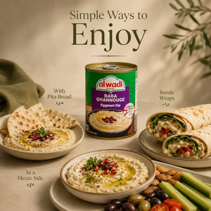 Alwadi Baba Ghanouj can with pita bread, hummus, and wraps on a table.