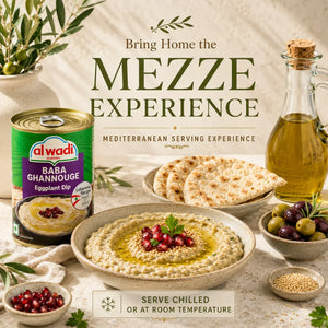 Alwadi Baba Ghannouj can with hummus, pita bread, olives, and olive oil on a rustic background with text 'Bring Home the Mezze Experience'.