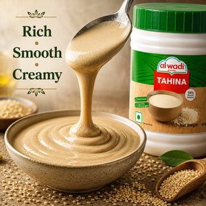 Tahini being poured into a bowl with an Alwadi Tahini container in the background.