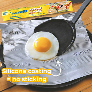 Non-stick frying pan foil with silicone coating used to cook a fried egg, packaging shown.
