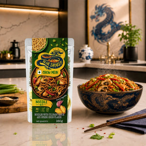 Blue Dragon Chow Mein noodle kit packaging with a bowl of noodles on a kitchen counter.