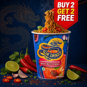 A Blue Dragon instant noodle cup labeled 'That Sweet Chili' surrounded by red chilies, lime halves, garlic, and green onions on a dark blue background with a gold dragon illustration. A red promotional badge in the top right reads 'BUY 2 GET 2 FREE'.