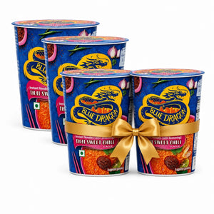 Four Blue Dragon Thai Sweet Chili noodles cups arranged in a fan shape on a white background, with the front two decorated with a gold ribbon and bow.