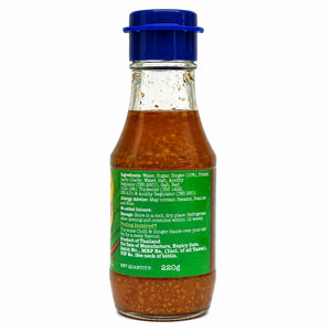 Chilli ginger sauce bottle with blue cap and ingredient label, 220g, isolated on white.