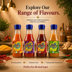 Four Blue Dragon sauce bottles—Mango Chilli, Sweet Chilli, Hot Chilli, Ginger Chilli—displayed on a kitchen counter surrounded by fresh ingredients.