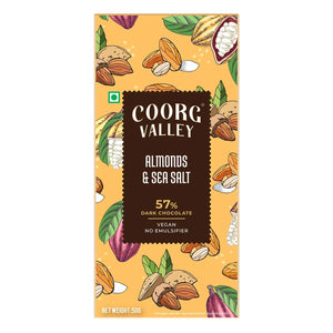 Coorg Valley Almonds & Sea Salt 57% dark chocolate bar with vegan label, colorful almond and cocoa bean illustrations, Sunbeam Merchantile imported gourmet product