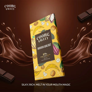 Coorg Valley Banana Walnut dark chocolate bar with banana and walnut illustrations on a chocolate splash background.