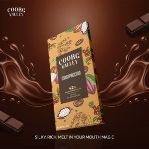 Coorg Valley CrispPaccino 42% dark vegan chocolate bar with cocoa illustrations and chocolate splash