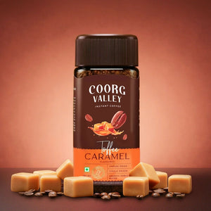 Coorg Valley toffee caramel instant coffee jar with caramel pieces and coffee beans on brown background