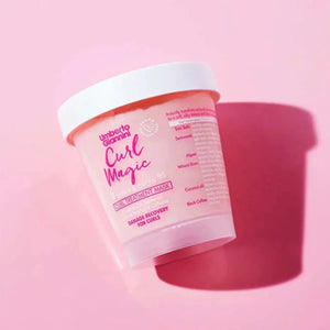 Umberto Giannini Curl Magic curl treatment mask container on pink background for damage recovery