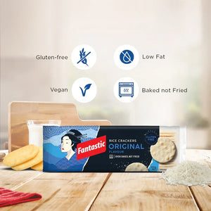Fantastic rice crackers original flavour pack on kitchen table with gluten-free, vegan, low fat icons