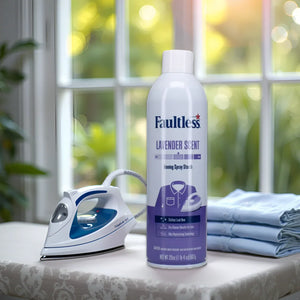 Faultless lavender scent ironing spray starch can, steam iron, and folded clothes on table near window