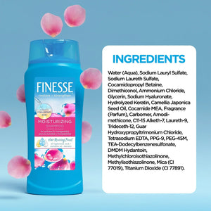 Finesse Moisturizing Shampoo bottle with hyaluronic acid and camellia oil surrounded by pink flower petals, ingredient list on side