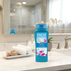 Finesse Normal Shampoo bottle on marble bathroom counter with towels and soap at Sunbeam Merchantile