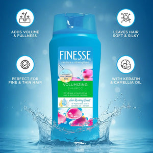 Finesse Volumizing Shampoo bottle with hyaluronic acid, keratin, camellia oil on blue water splash background