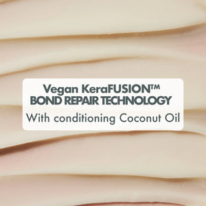 Close-up of creamy conditioner texture with text Vegan KeraFUSION Bond Repair Technology and conditioning coconut oil