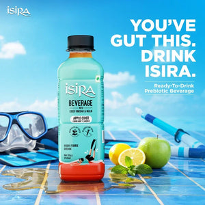 Isira Apple Cider Lemon Mint flavored prebiotic beverage bottle on wet blue tile with diving mask, snorkel, green apple, lemon, and mint