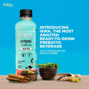 Isira prebiotic beverage bottle with apple cider lemon mint flavor surrounded by Indian herbs and spices on wooden surface