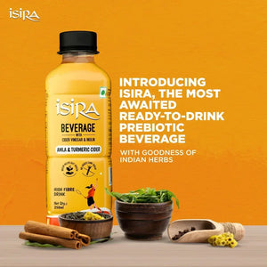 Isira Amla & Turmeric cider prebiotic beverage bottle with Indian herbs and spices on orange background