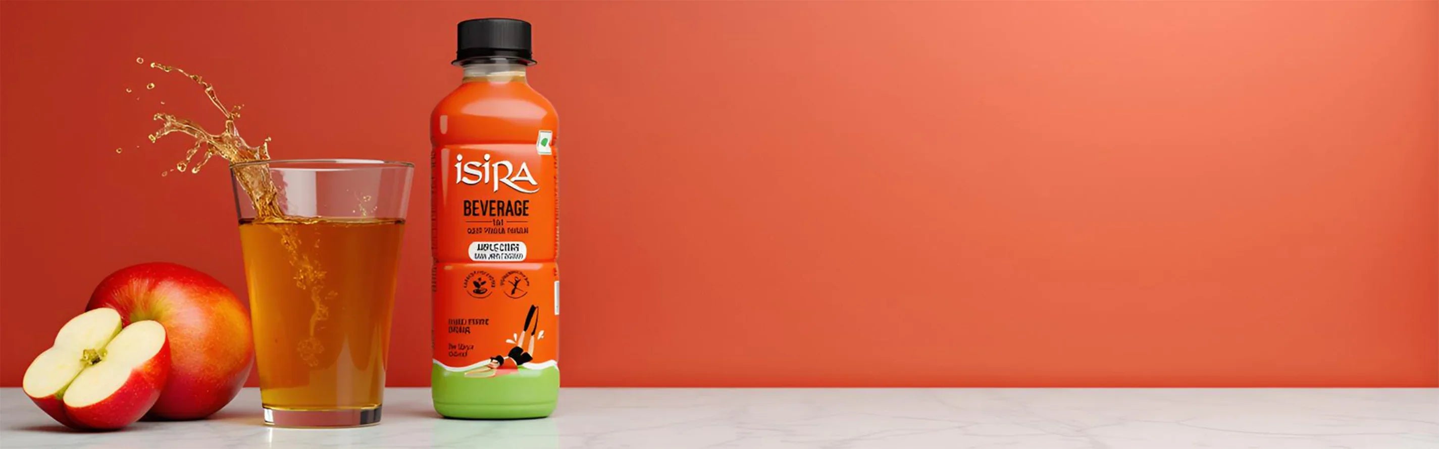 Isira apple beverage bottle with poured apple juice in glass and fresh apples on white marble