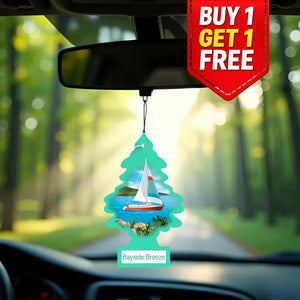 Car air freshener with sailboat design hanging from a car's rearview mirror with a 'Buy 1 Get 1 Free' offer.