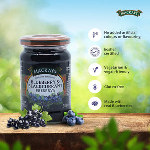 Mackays Blueberry & Blackcurrant Preserve jar on wooden surface with fresh berries and health benefits listed