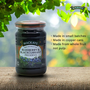 Jar of Mackays Blueberry & Blackcurrant Preserve on burlap with green leaves and product benefits