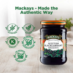 Jar of Mackays Scottish Blackcurrant Preserve on wooden table, vegan, gluten-free, no artificial preservatives or colours.