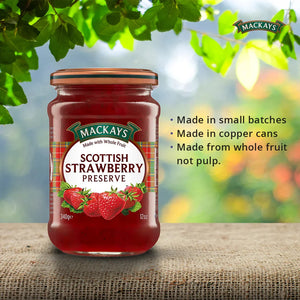Jar of Mackays Scottish Strawberry Preserve on burlap with green leafy background and product highlights