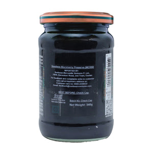 Back label of a glass jar of seedless blackberry preserve, 340g, on a white background
