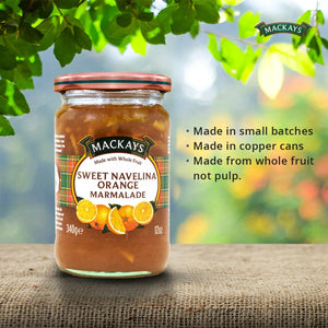 Jar of Mackays Sweet Navelina Orange Marmalade on rustic surface with leaves and product benefits