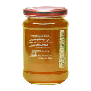 Back view of a glass jar labeled Three Fruit Marmalade, 340g, with nutritional info visible.
