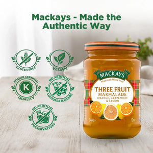 Mackays Three Fruit Marmalade jar with orange, grapefruit, and lemon on table, gluten-free, vegan, kosher, no artificial additives.