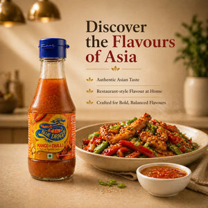 Mango and chilli sauce bottle with stir-fried chicken and vegetables, Asian cuisine