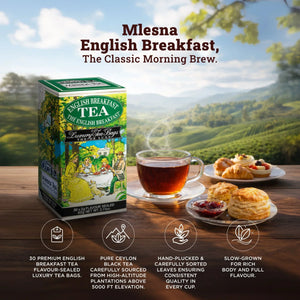 Box of English breakfast tea with glass cup of tea, scones, and pastries on a wooden table outdoors.