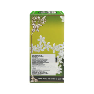 Green tea box with white jasmine flowers and information label on a green background