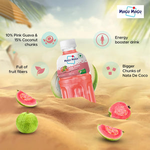 Mogu Mogu Pink Guava juice bottle in sandy setting with fresh guava and coconut, energy booster drink