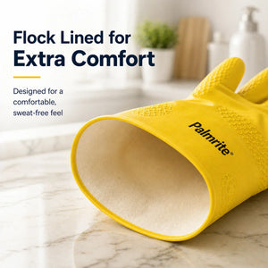 Yellow Palmrite dishwashing glove with flock-lined interior for comfort, on marble countertop