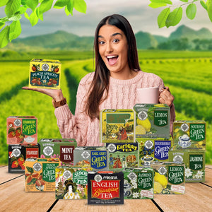 Woman holding peach apricot tea box with assorted green tea flavors in scenic tea plantation.