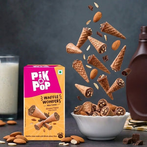 Pik n Pop almond mini waffle cones with visible almonds and chocolate, box and bowl arrangement