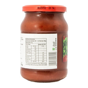 Jar of tomato sauce with a label on a white background