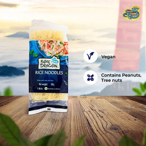 Blue Dragon rice noodles pack on wooden table with vegan and nut allergy icons
