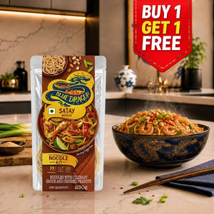 Blue Dragon Satay Noodles Kit with cooked serving, featuring shrimp, peanuts, and veggies, Buy 1 Get 1 Free offer