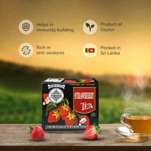 Box of strawberry tea with fresh strawberries and glass cup, Ceylon tea health benefits highlighted