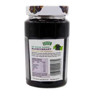 Jar of Stute no sugar added blackcurrant jam with sweetener on white background