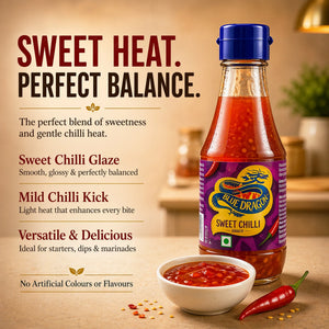 Bottle of Blue Dragon sweet chilli sauce with a bowl of sauce and red chili pepper on a kitchen counter